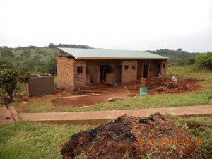 Ntenjeru guard house nears completion with addtition of roof.  After guard house is secure, plans will move forward for vocational school groundbreaking and staffing of medical clinic.