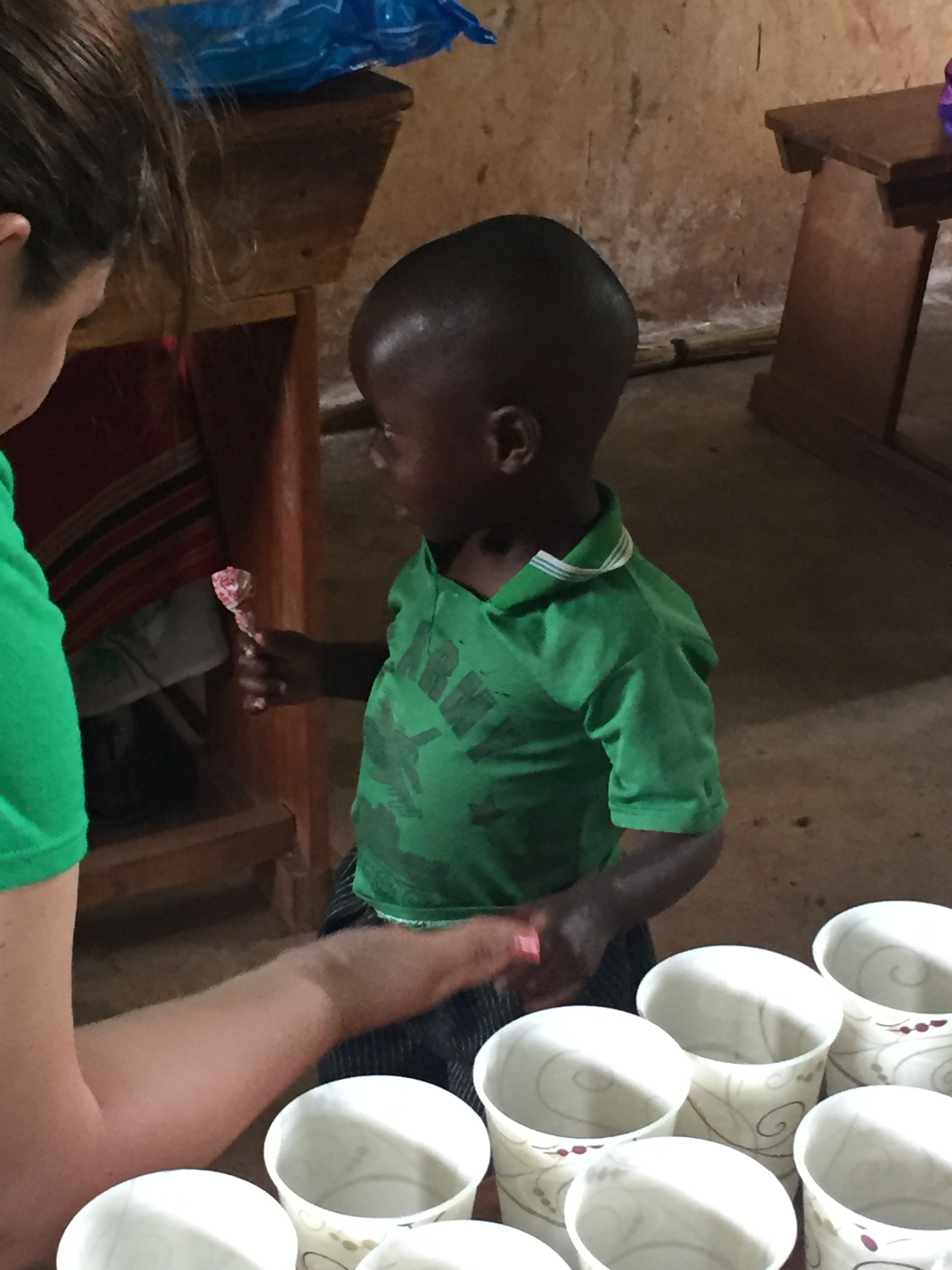 Volunteer serving a young student